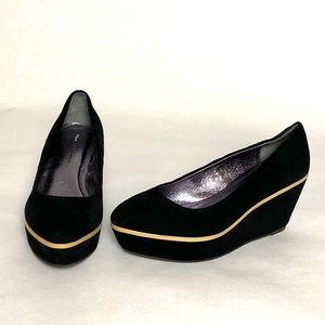 Suede platforms with nude patent leather detail.